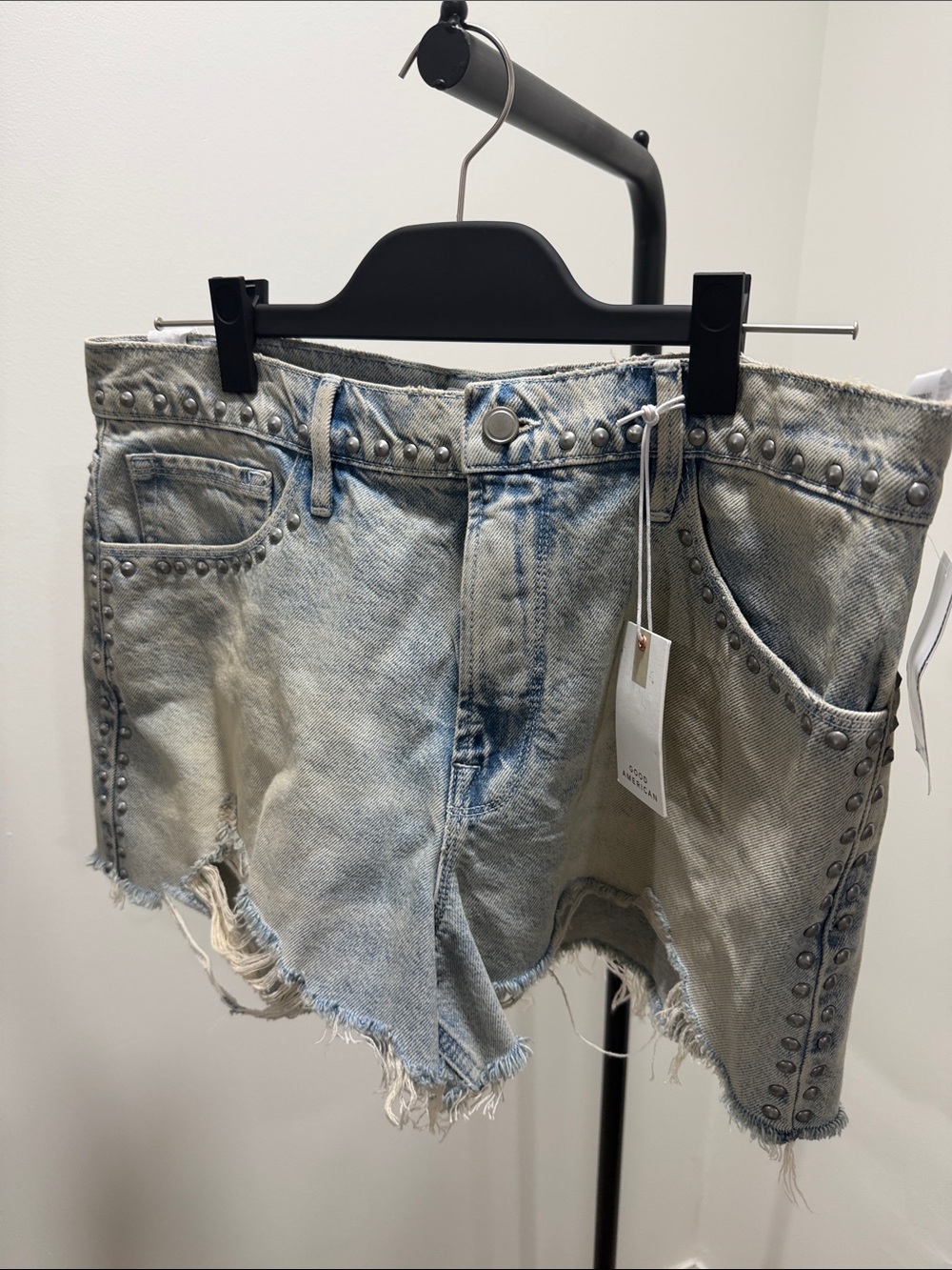 Good American Studded Light Wash Denim Cutoff Shorts